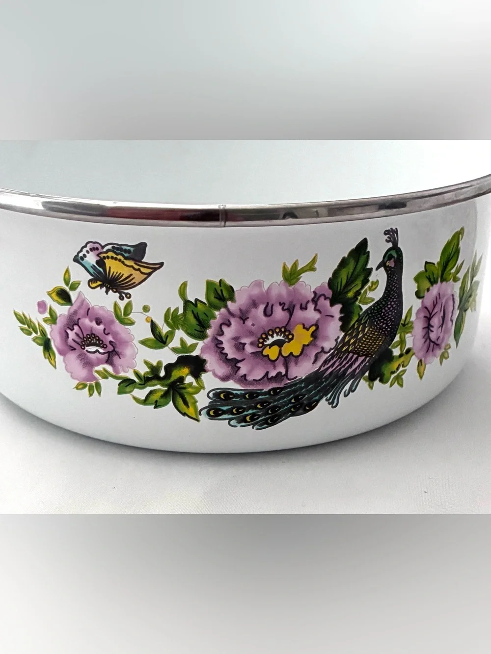 Vintage enamel mixing bowls featuring peacock and floral pattern